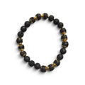 The Regent men’s bracelet with 8mm black lava stone beads and 18kt gold-plated stainless steel accents on a white background.