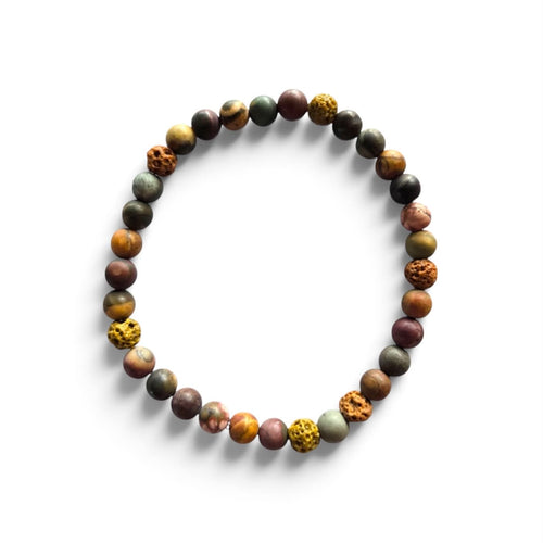 The Artisan Terra men’s bracelet with 6mm matte Picasso Jasper and textured lava stone accent beads in earthy green, brown, rust, and golden tones on a white background.